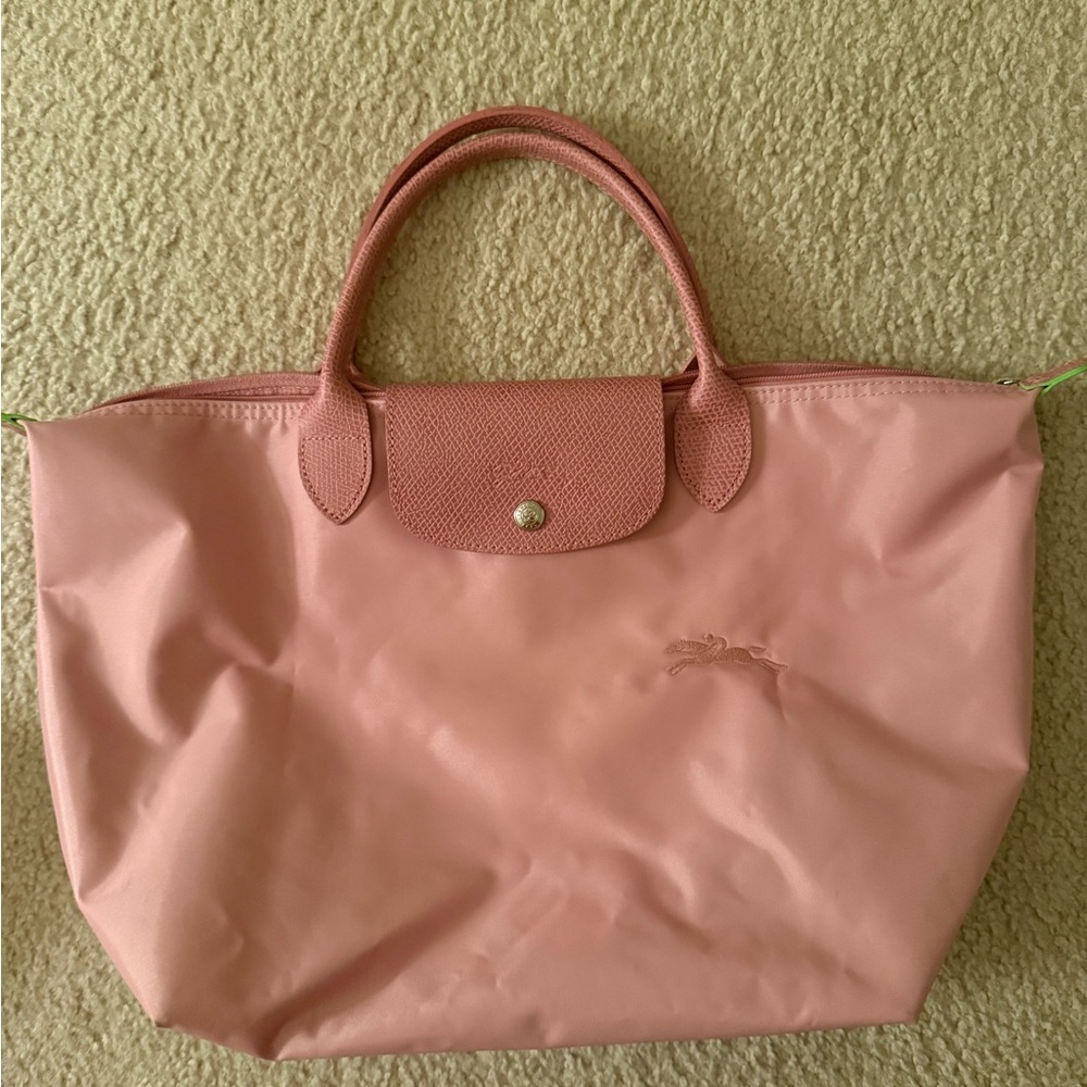 Longchamp Pink Satchel with Foldable Design and Minimalist Style